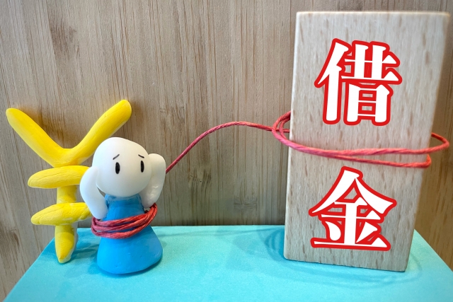 お金を手に頭を抱える。大垣市で債務整理の無料相談ができます